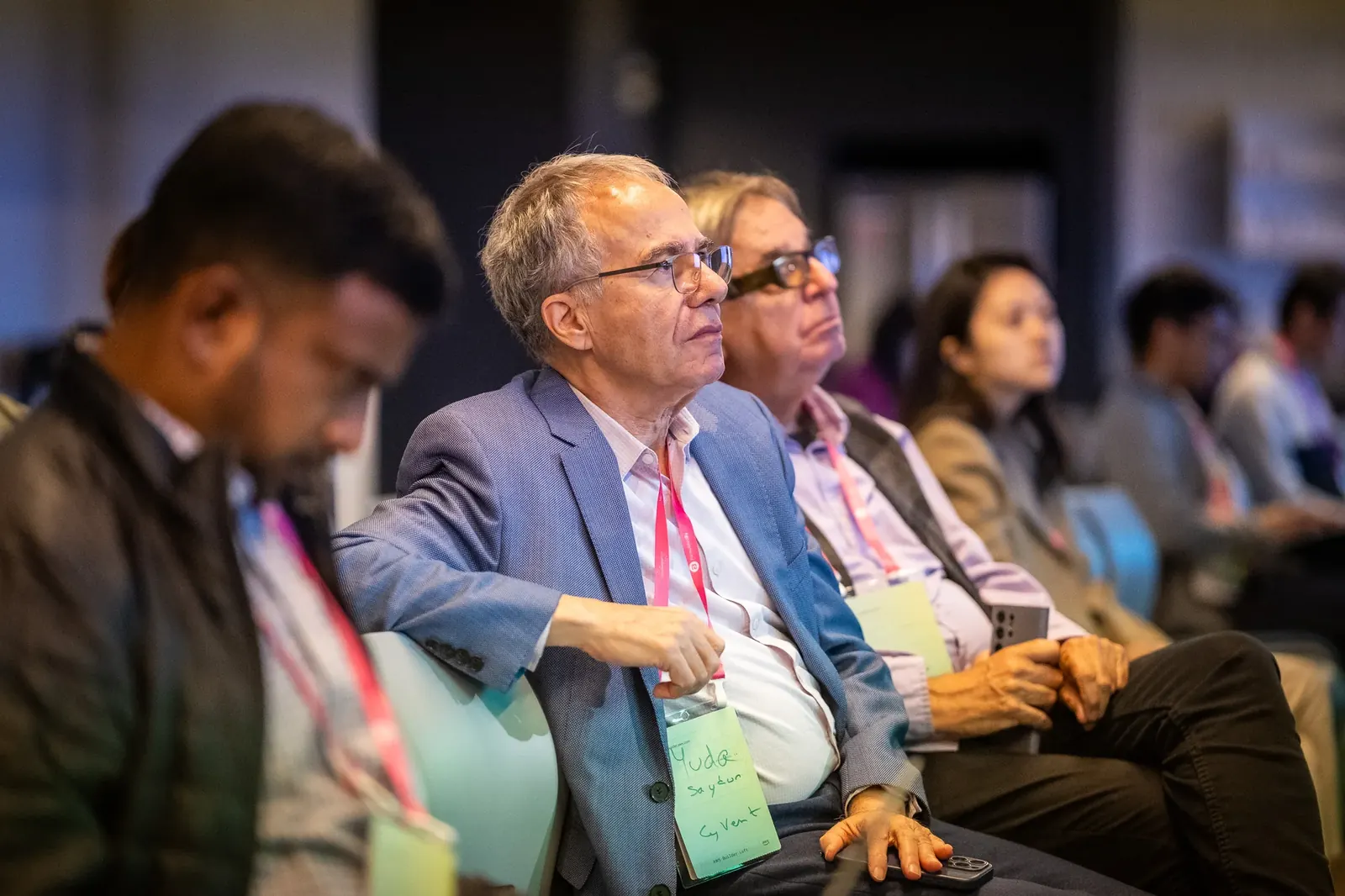 Attendee listening during a conference presentation