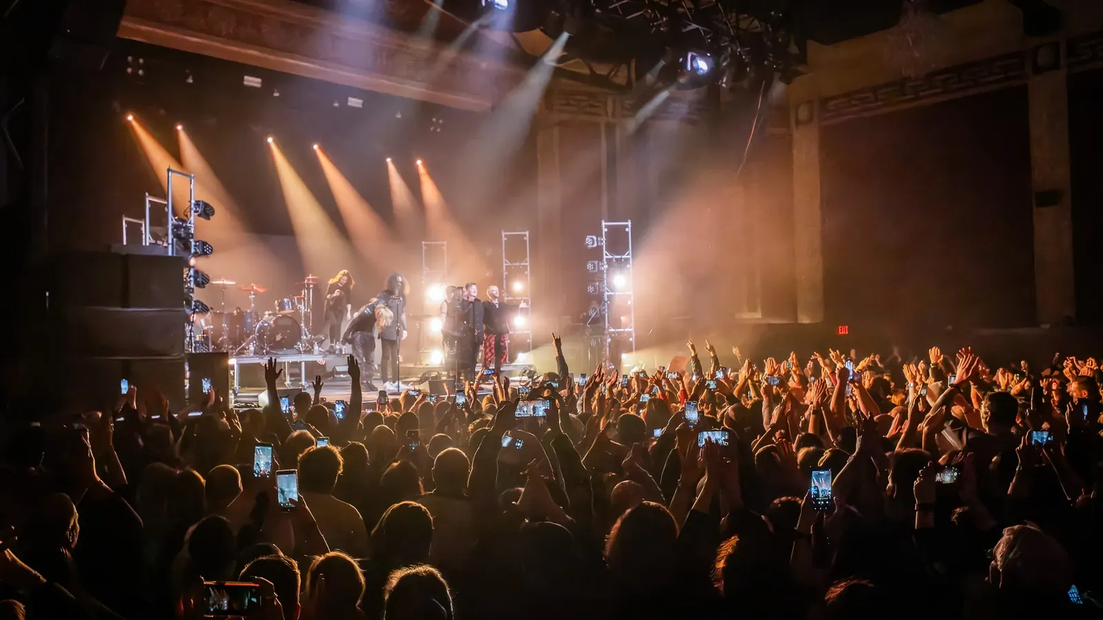Concert crowd and a brightly lit stage