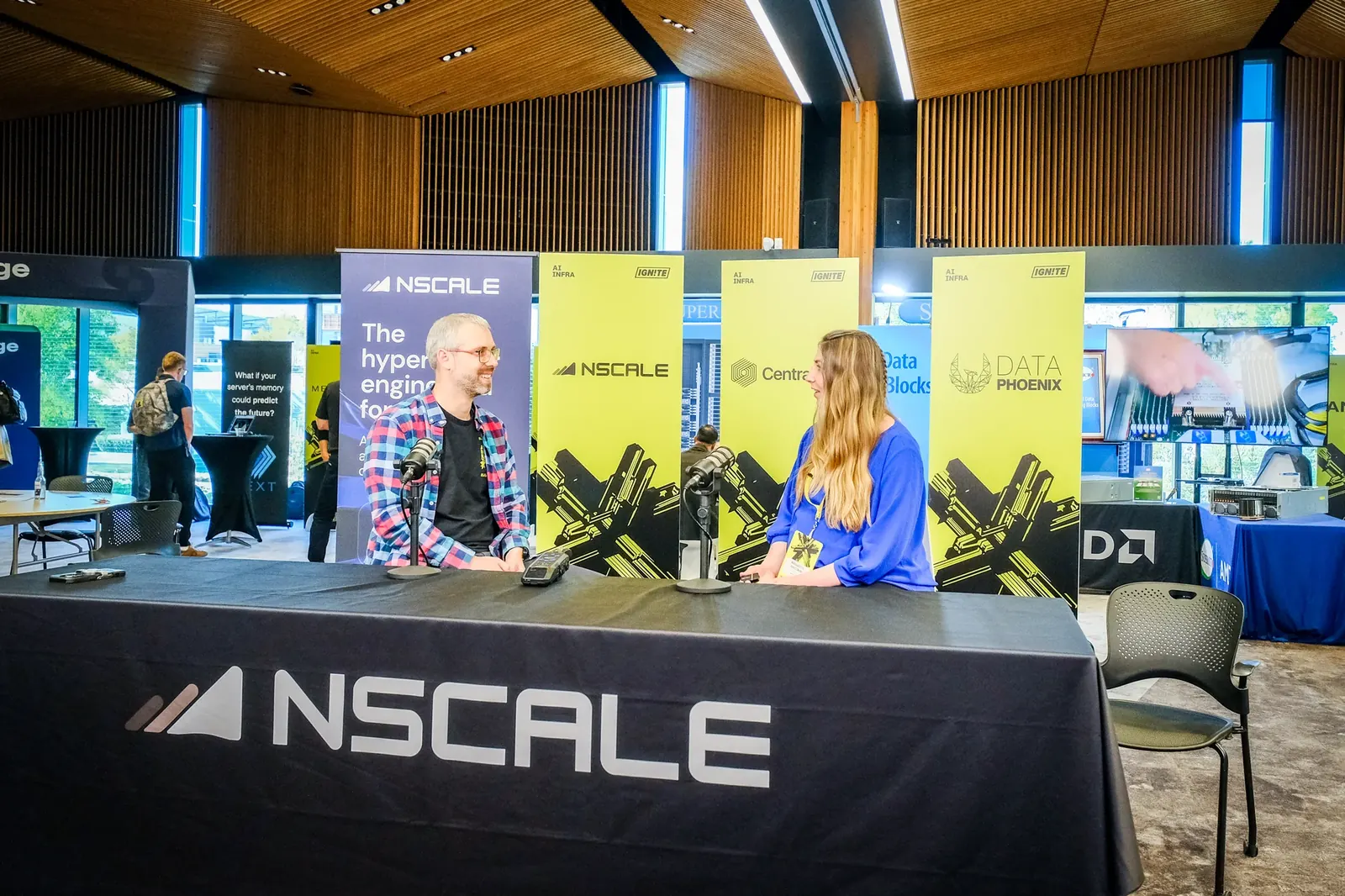 Two participants at an on-site interview desk