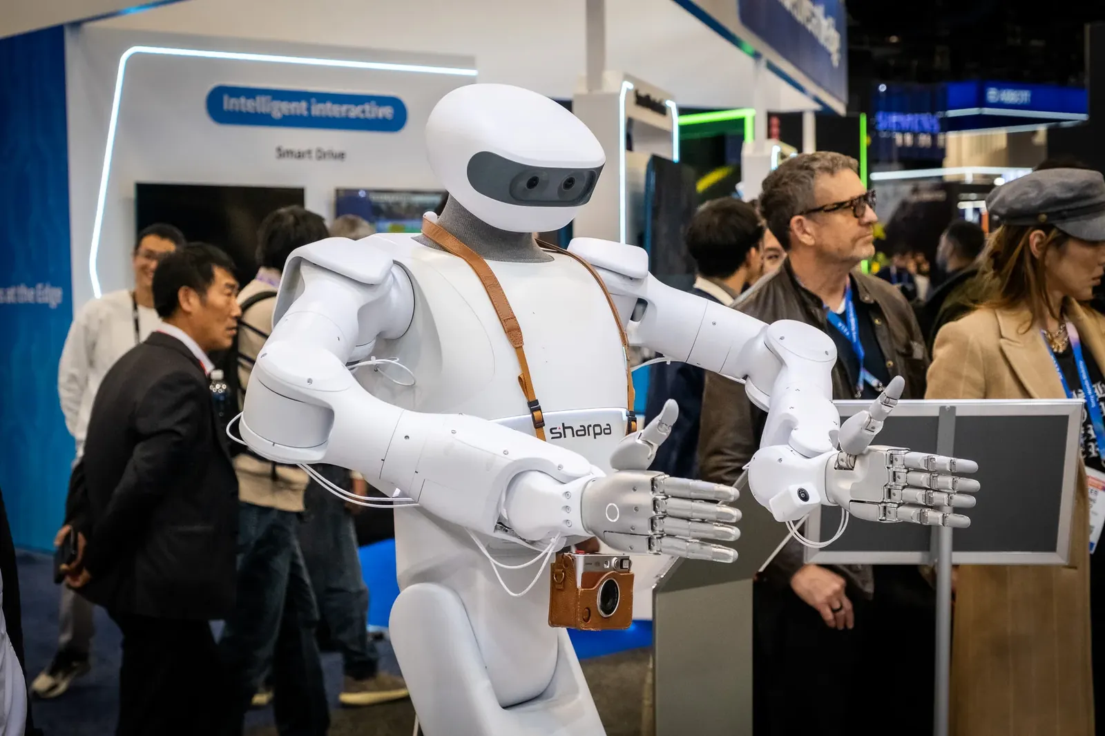 Robot demonstration surrounded by exhibition visitors