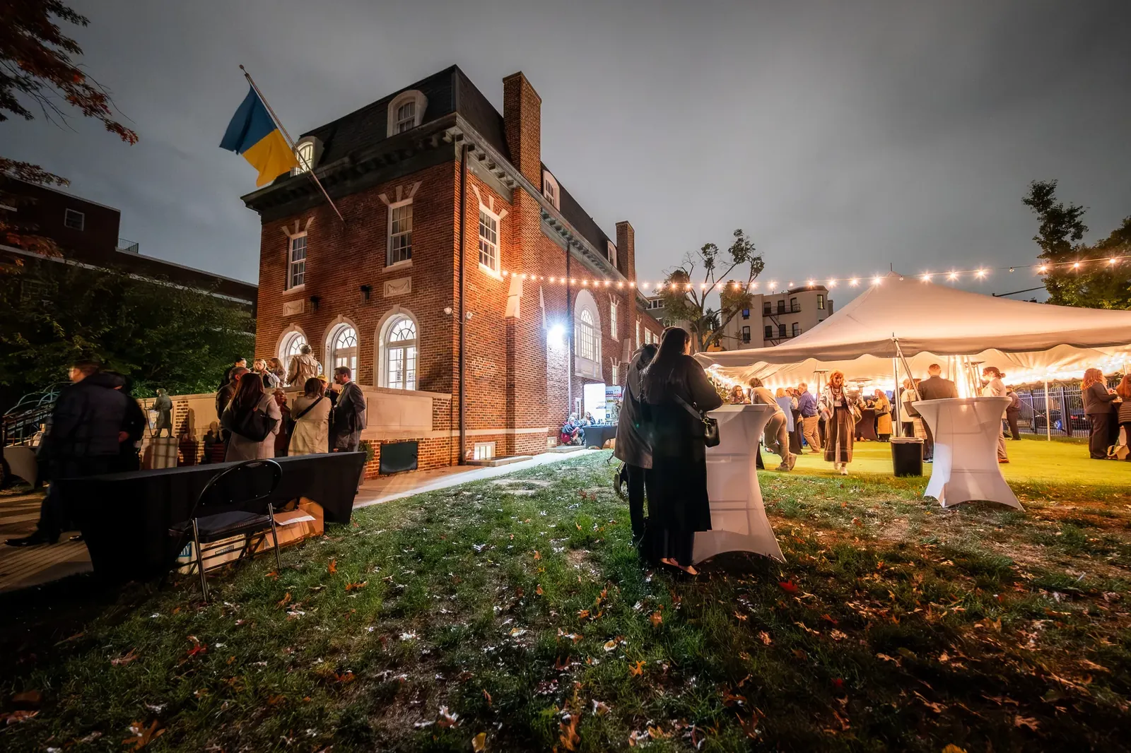 Evening reception outside a brick building in Washington